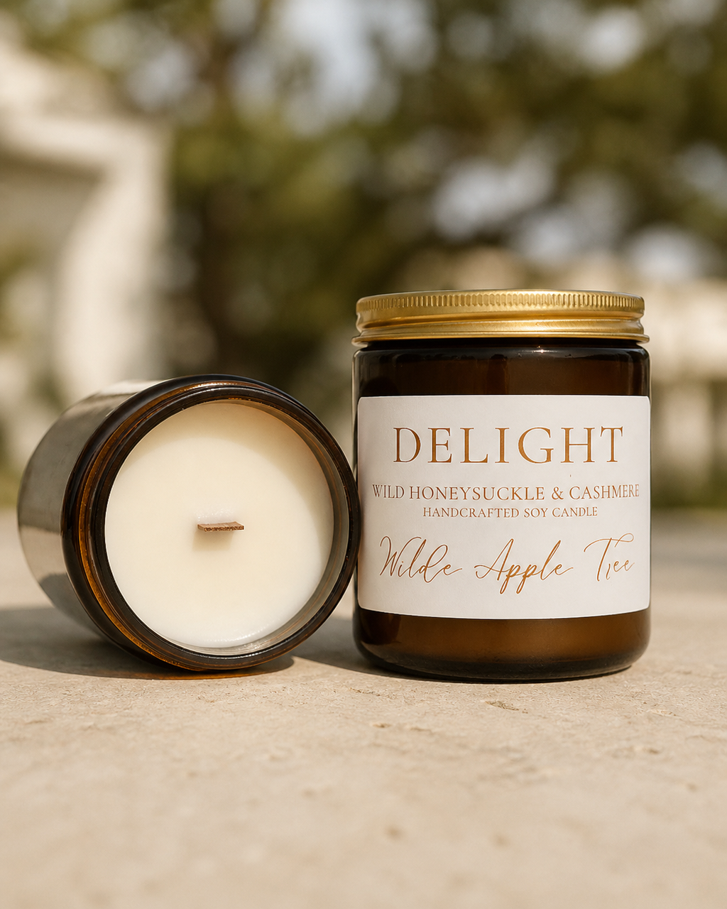 Wilde Apple Tree Delight medium soy candle in amber glass jar with lid removed showing natural wooden wick, wild honeysuckle and cashmere scent, handcrafted in Australia