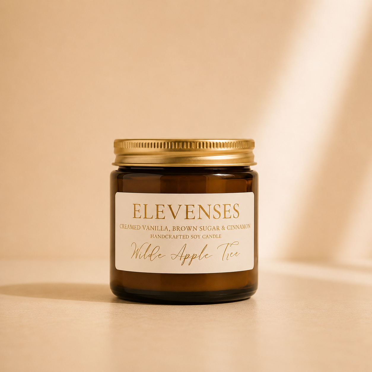 Wilde Apple Tree Elevenses mini soy candle in amber glass jar with gold lid, scented with creamed vanilla, brown sugar and cinnamon, handcrafted in Australia