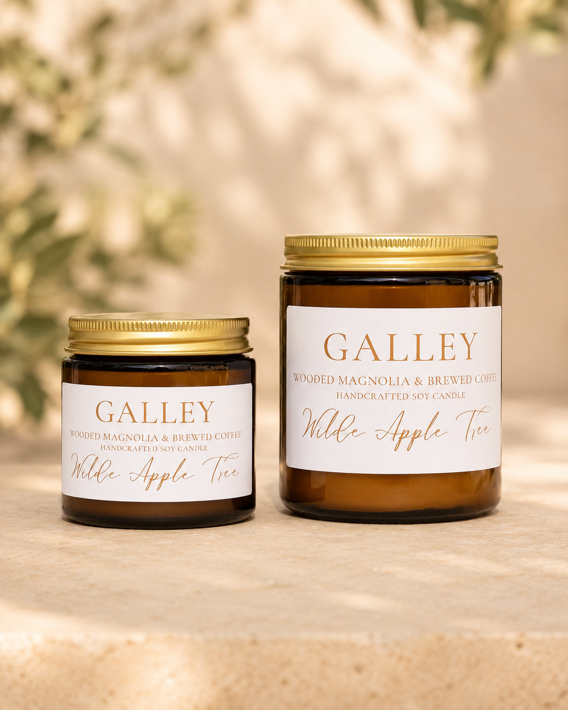 Wilde Apple Tree Galley handcrafted soy candles in mini and medium amber glass jars side by side with soft bokeh background, wooded magnolia and brewed coffee scent, made in Australia